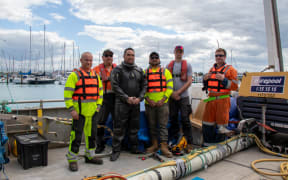 Workers get ready to fix a sewage pipe in Nelson which is leaking into the ocean.