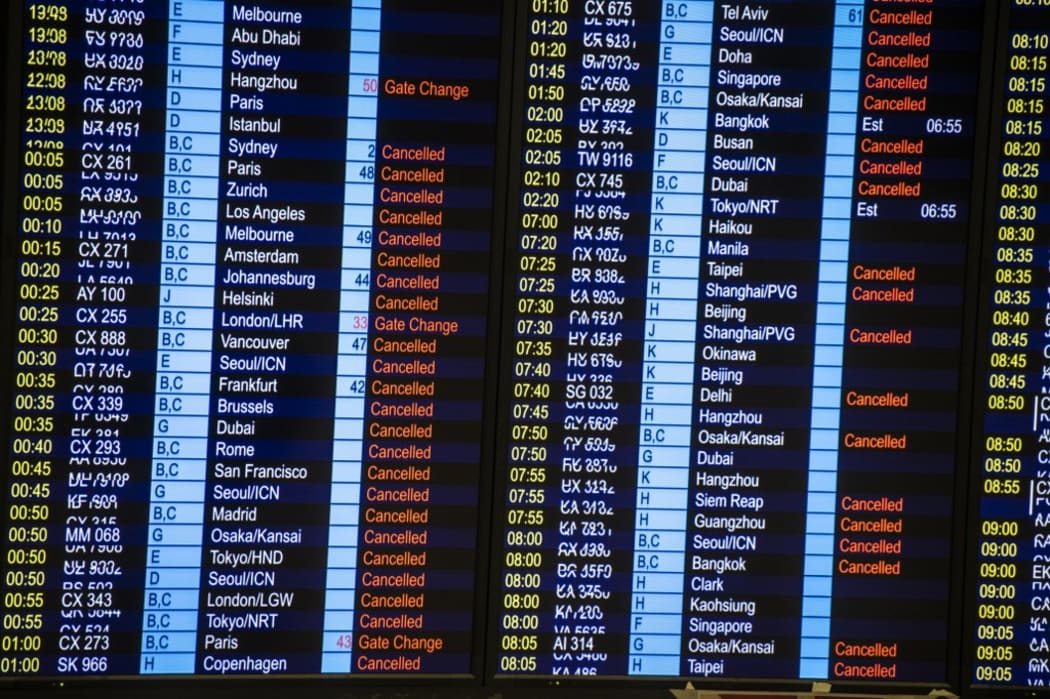 A flight information display board in Hong Kong International Airport in Hong Kong on August 13, 2019.