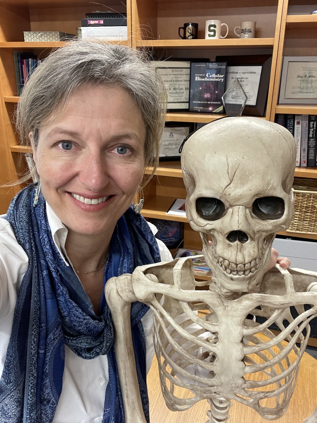 Professor Laura McCabe and her favourite skeleton.