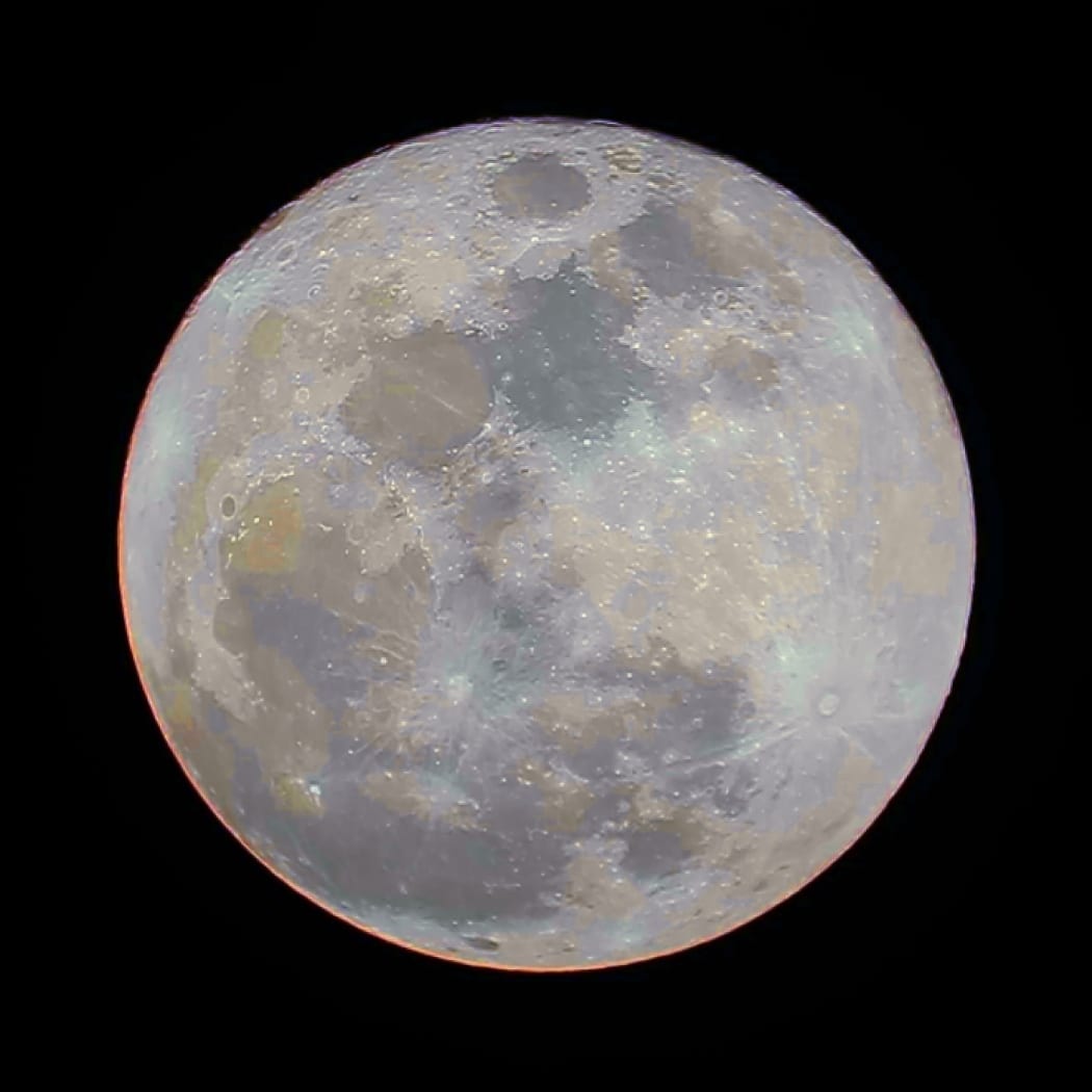 The super blue moon, as taken with a 10-inch telescope a backyard in Auckland. The picture shoes the different mineral compositions of the moon's surface, to see many beautiful colors.