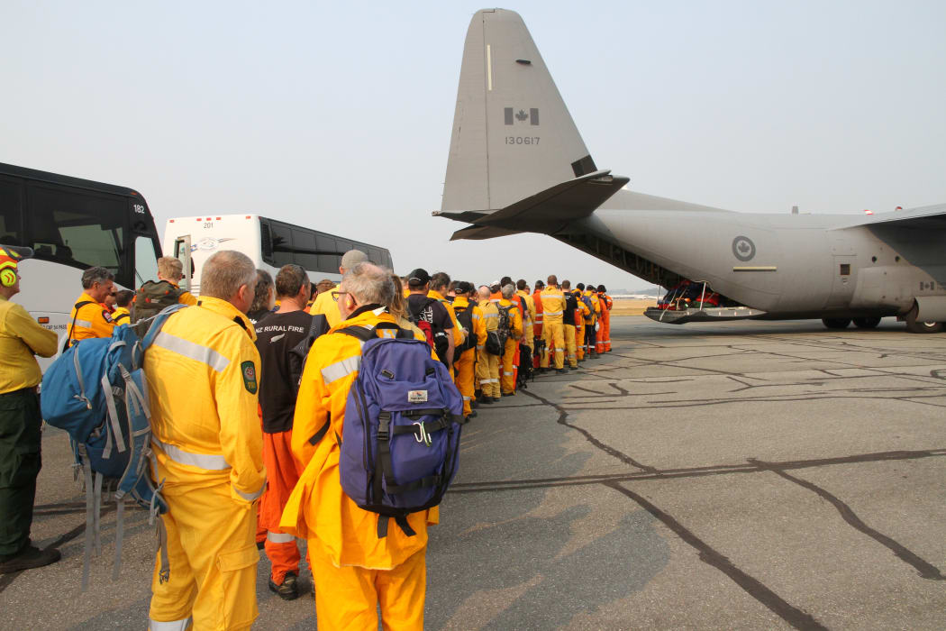 New Zealand firefighters line up to come home after five weeks abroad.