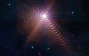 Image of WR140 binary taken by NASA’s James Webb Space Telescope with the puzzling concentric rings