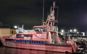 The Wellington police boat moored at Wellington Harbour after spending the day searching for a man thought to have gone overboard from the East By West ferry on Friday 24 May 2024.
