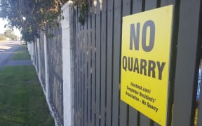 An anti-quarry sign in Templeton. Dozens are stuck on fences throughout the community.