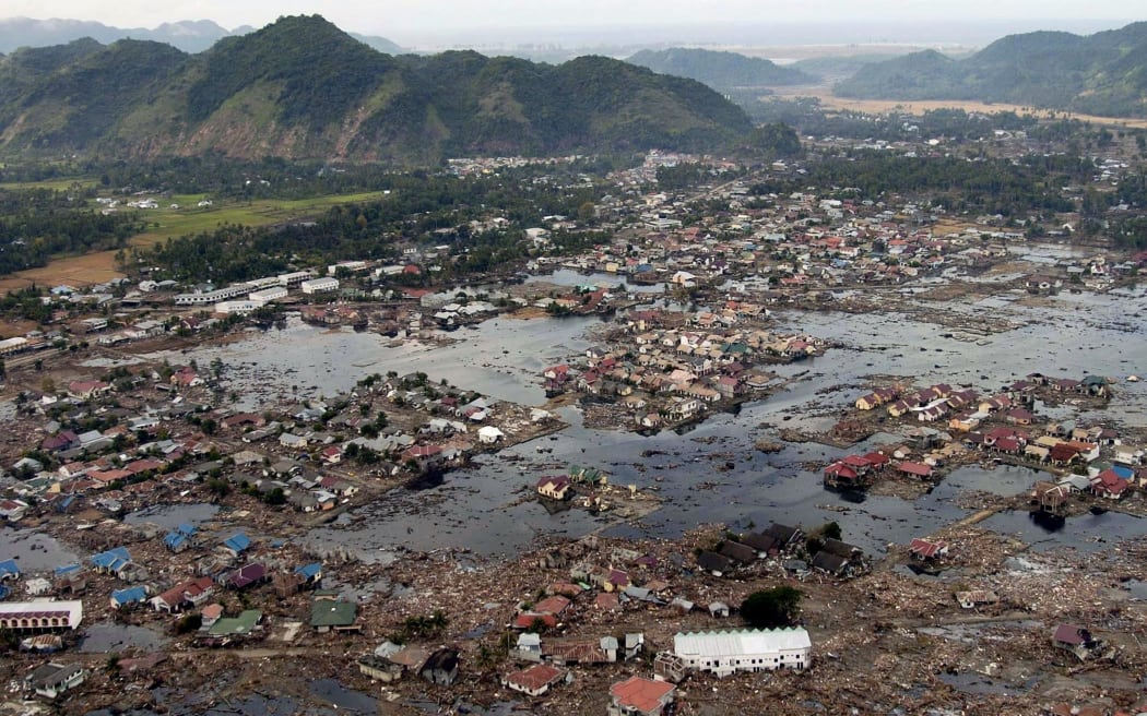 This US Navy handout photo taken 02 January 2005 shows a village along the coast of Sumatra in ruins after an earthquake and tsunami stuck off the coast 26 December.