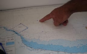 Volunteers point out the location of the rescue in Geographe Bay. (ABC South West WA: Madigan Landry)