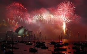 Fireworks light the sky over the Opera House and Harbour Bridge during New Year's Eve celebrations in Sydney.