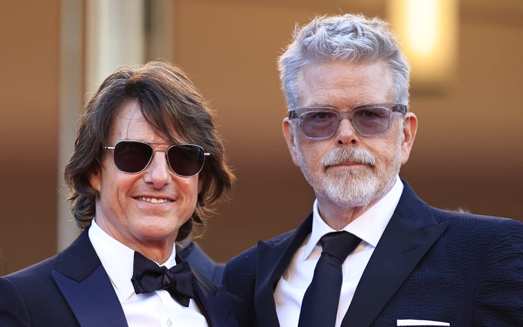 US actor and producer Tom Cruise (L) and US film director, screenwriter Christopher Mcquarrie (R) arrive for the screening of the film "Mission: Impossible - The Final Reckoning" at the 78th edition of the Cannes Film Festival in Cannes, southern France, on May 14, 2025. (Photo by Valery HACHE / AFP)
