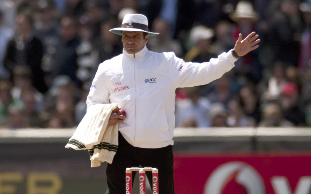 Umpire Aleem Dar signals a no ball.