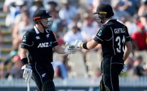 Black Caps batsmen Martin Guptill, right, and Henry Nicholls.