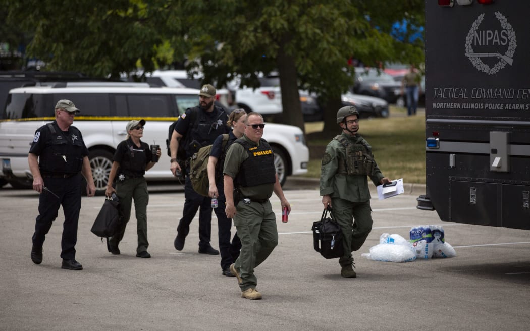 Police at the scene of a shooting at a Fourth of July parade in Highland Park, Illinois.