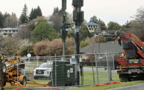 Contractors removing a destroyed One NZ cellphone communications tower near Wānaka cemetery on Friday 10 October, 2025, after the tower was vandalised.