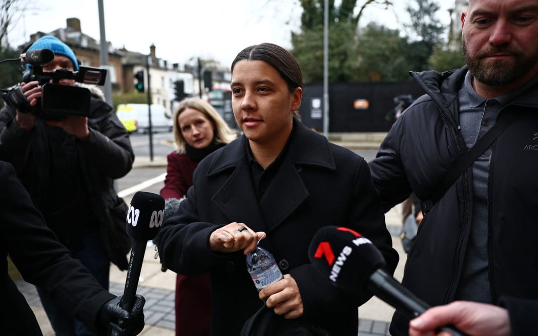 Chelsea's Australian striker Sam Kerr reacts as she arrives at Kingston Crown Court in south London on February 3, 2025, for the start of her trial. Kerr was charged with causing a police officer harassment, alarm or distress during an incident in Twickenham, south-west London, on January 30, 2023, and pleaded not guily to racially aggravated harassment in March of 2024. (Photo by HENRY NICHOLLS / AFP)