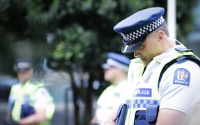 Police standing at a cordon