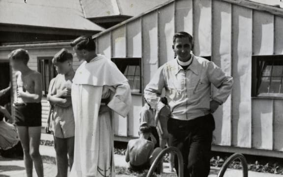 Rector Fred Durning, right, next to Father Michael Shirres, who  was recently exposed as a pedophile, with St Patrick’s College (Upper Hutt) students at a sports event in 1955.