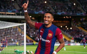 Raphinha celebrates a goal for Barcelona.
