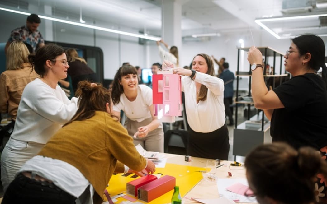 Architecture + Women NZ putting the finishing touches to their creation