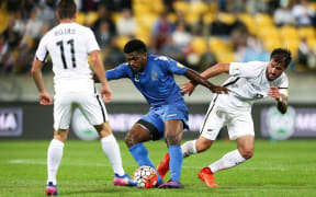 Setareki Hughes, middle, of Fiji against New Zealand in an international.