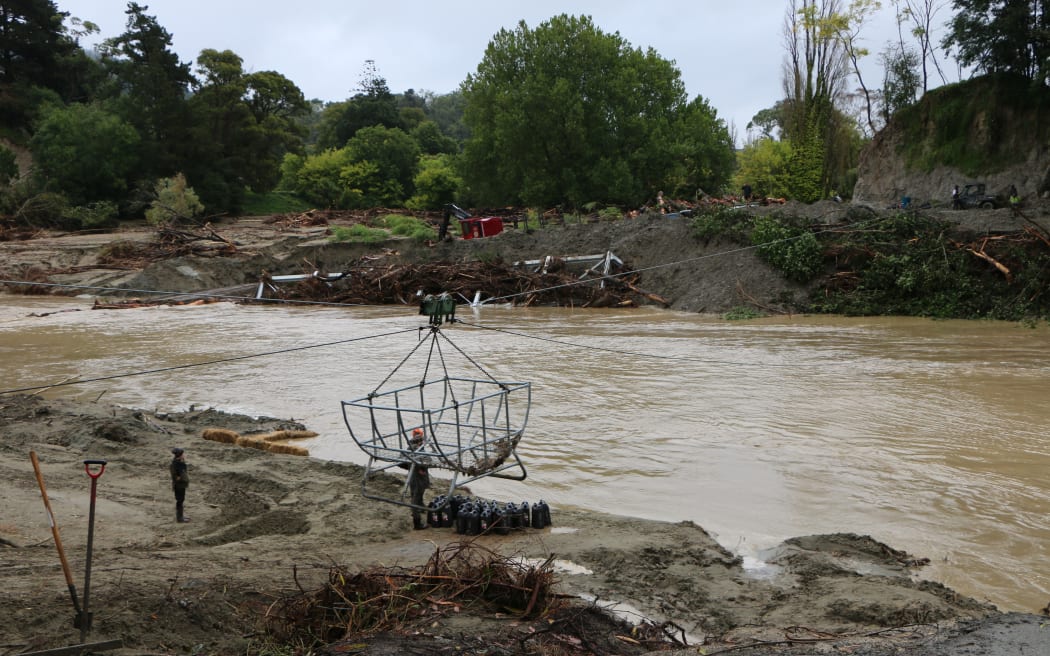 A make-shift flying-fox type pulley system is being used to get supplies to the cut off farming community of Rissington.