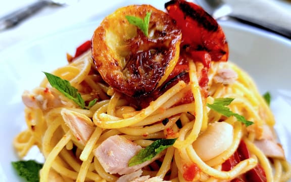 Pasta with white beans and roasted tomatoes.