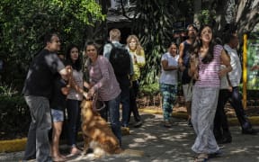 People on the streets in Mexico City following a powerful quake centred on the south coast on 23 June 2020.