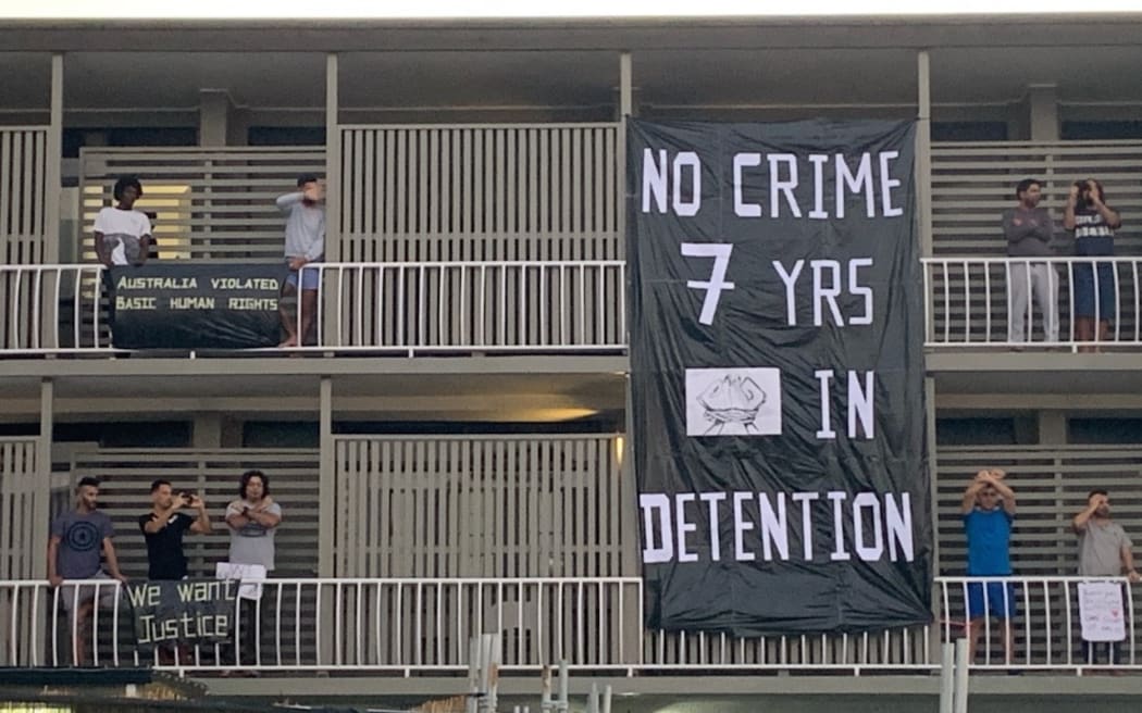 Refugees protest on balconies in the Brisbane APOD.