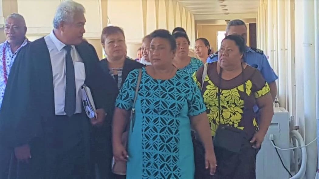 Convicted nurses Leutogi Te'o (C) and Luse Tauvale (R) talking to their lawyer after entering guilty pleasguilty pleas