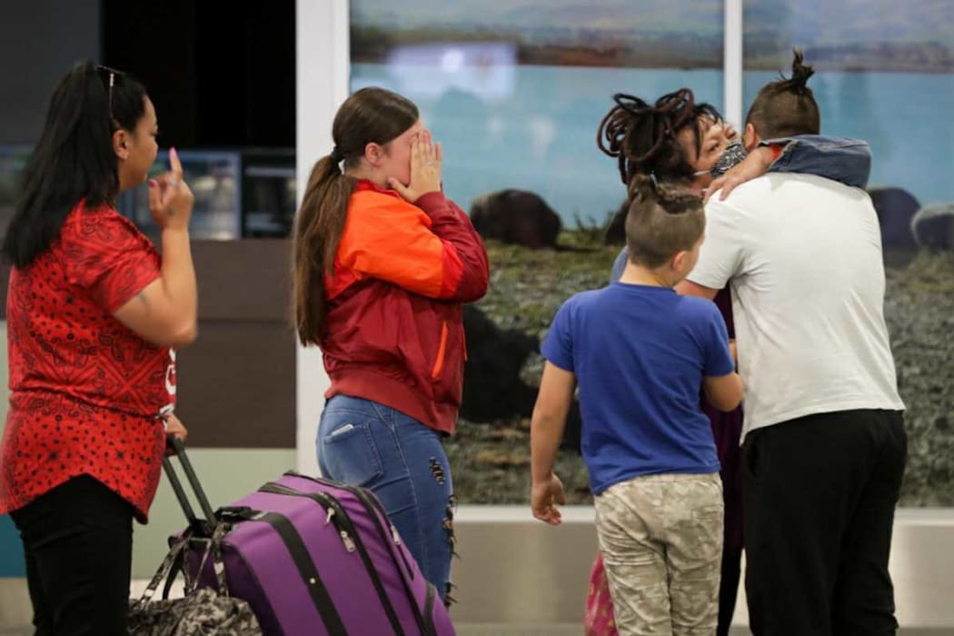 Loved ones embrace at Christchurch Airport