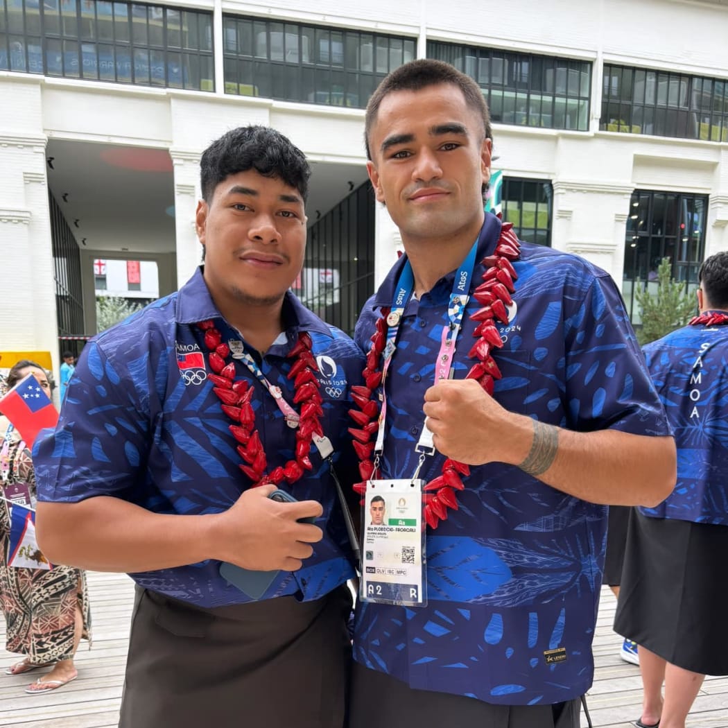 Samoan lifter Don Opeloge (left) with boxer Ato Plodzicki-Faoagali in Paris. Opeloge competes in weightlifting on Saturday, August 10. Photo: Team Samoa