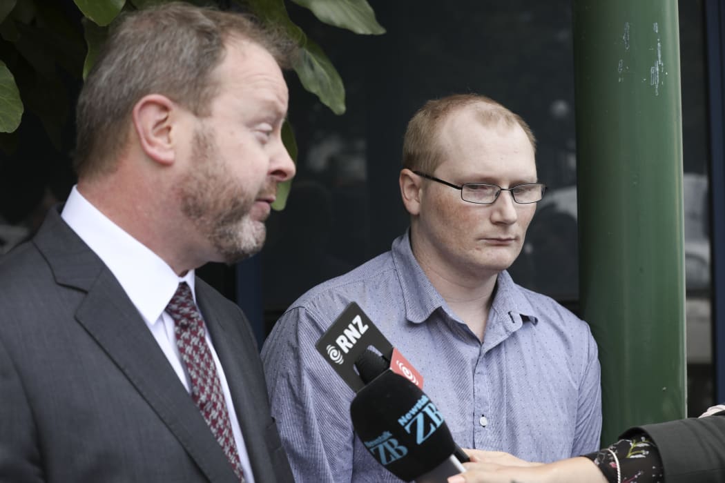 Paddy Woods listens on as his lawyer Kevin Preston makes a statement