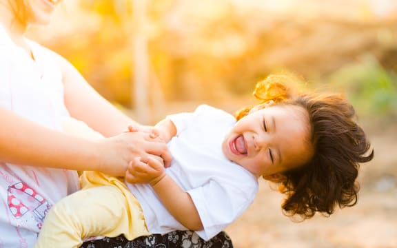 happy kid with mother