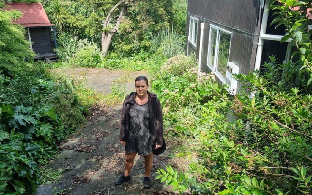 Phillipa Miller-Ibos at her flood-damaged home in Auckland.