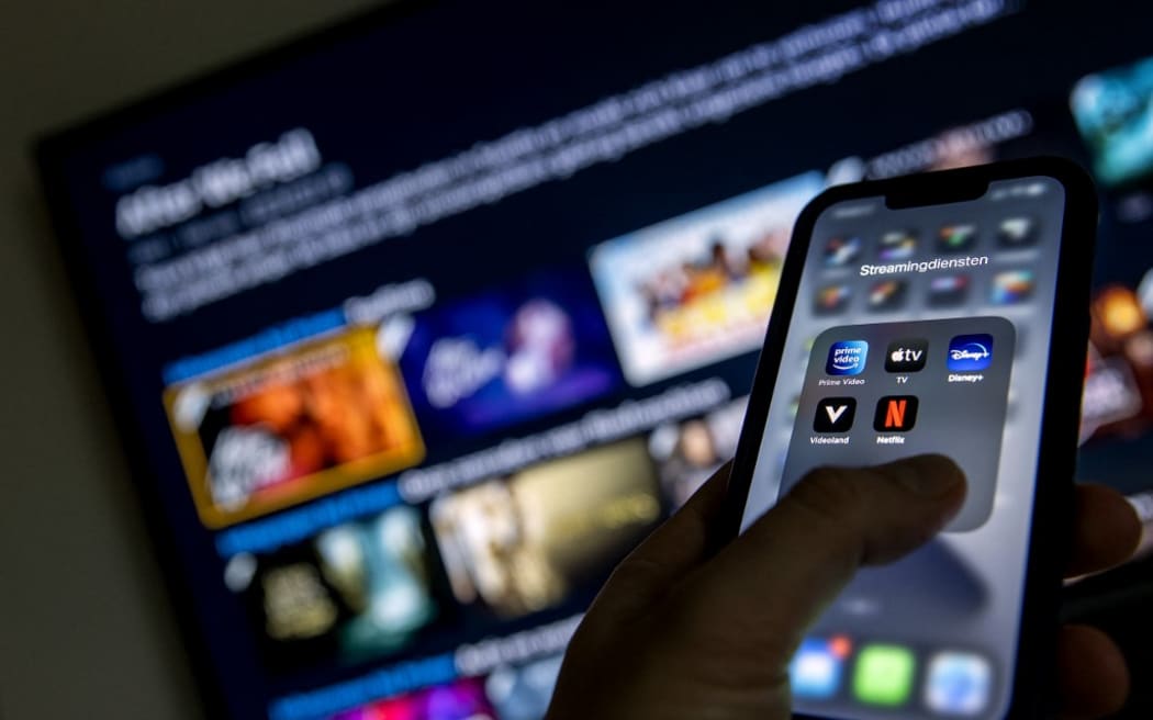 2022-01-19 12:42:43 ILLUSTRATIVE - Applications from streaming services Disney Plus, Amazon Prime Video, Apple TV, Videoland and Netflix on a phone.