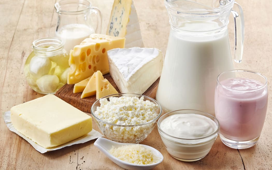 Various fresh dairy products on wooden background