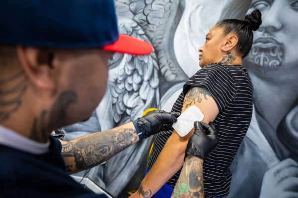 Leroy Roberts of Maia Ink tattooing a client