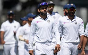 India captain Virat Kohli, centre, walks from the field with his team after losing the match to New Zealand during day four of the first Test cricket match between New Zealand and India at the Basin Reserve in Wellington on February 24, 2020.