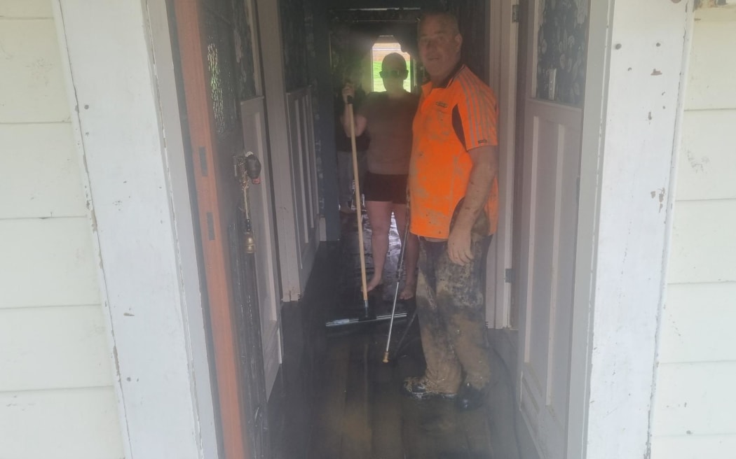 Friends and family help clean Christy Wright's flood damage home. A sudden Teddy keeps a vigil at Christy Wright's flood damaged home.
