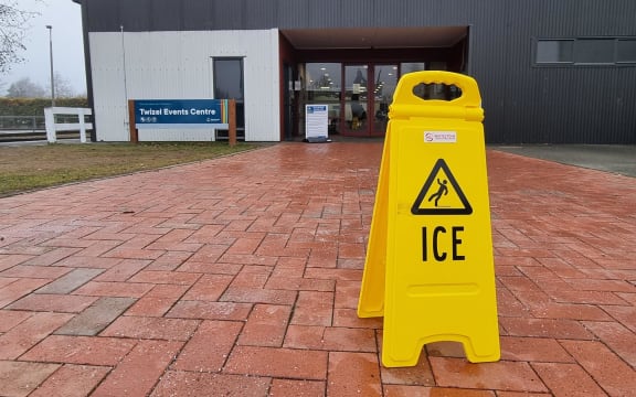 Twizel Events Centre with a sign warning people to be careful of slipping due to ice on the pavement, pictured on 18 July, 2024.
