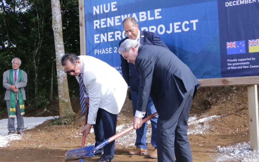 Niue minister of finance and infrastructure Crossley Tatui and Winston Peters turn the soil in the renewable energy ground-breaking ceremony.