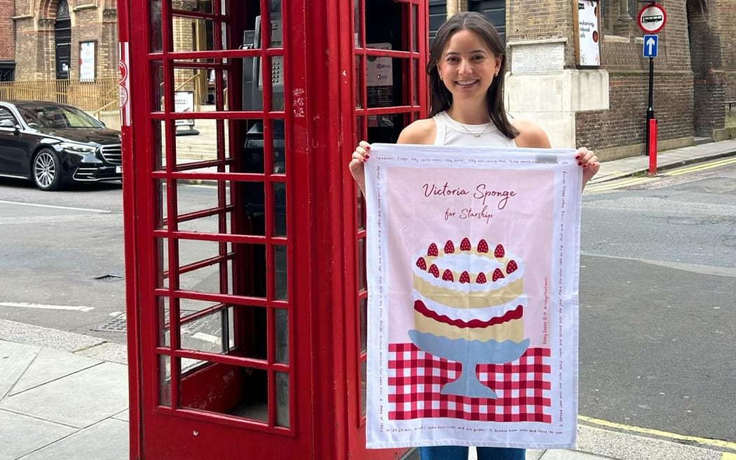 Ruby with her latest tea towel design Victoria Sponge