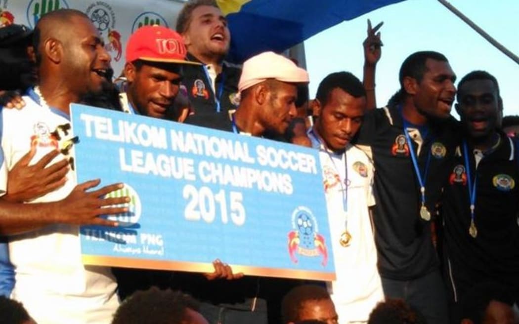 Lae City Dwellers celebrate winning the PNG National Soccer League title.