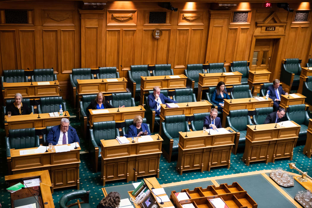 National MPs spread out in the debating chamber to meet level 2 distancing requirements