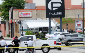 ORLANDO, FLORIDA - JUNE 12: Orlando police officers seen outside of Pulse nightclub after a fatal shooting and hostage situation on June 12, 2016 in Orlando, Florida. The suspected shooter, Omar Mateen, was shot and killed by police.
