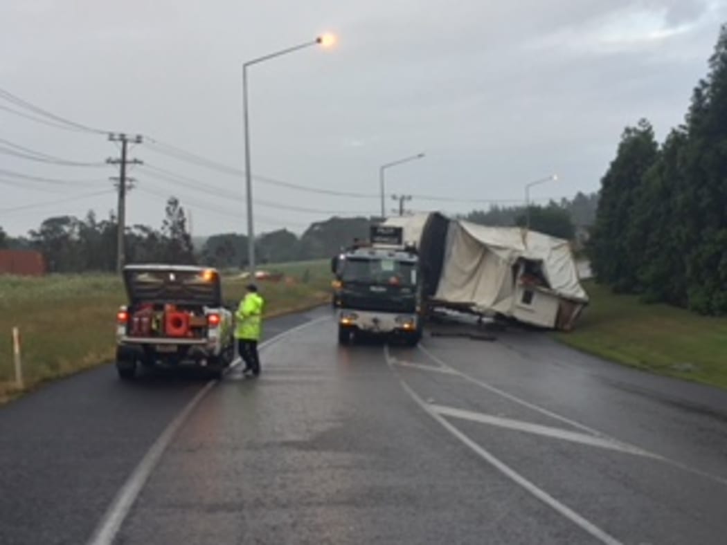 Police are attempting to remove the house off the road.