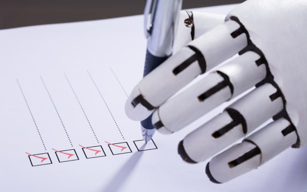 Close-up Of A Robot Hand Ticking Off Checkboxes On Document With Pen
