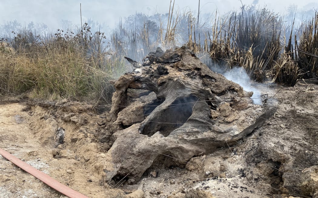 The fire has burned deep into underground stumps and peat, making it difficult to extinguish.