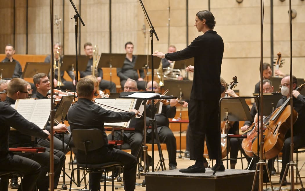 Conductor Luka Venter on the podium with the Slovak Radio Symphony Orchestra