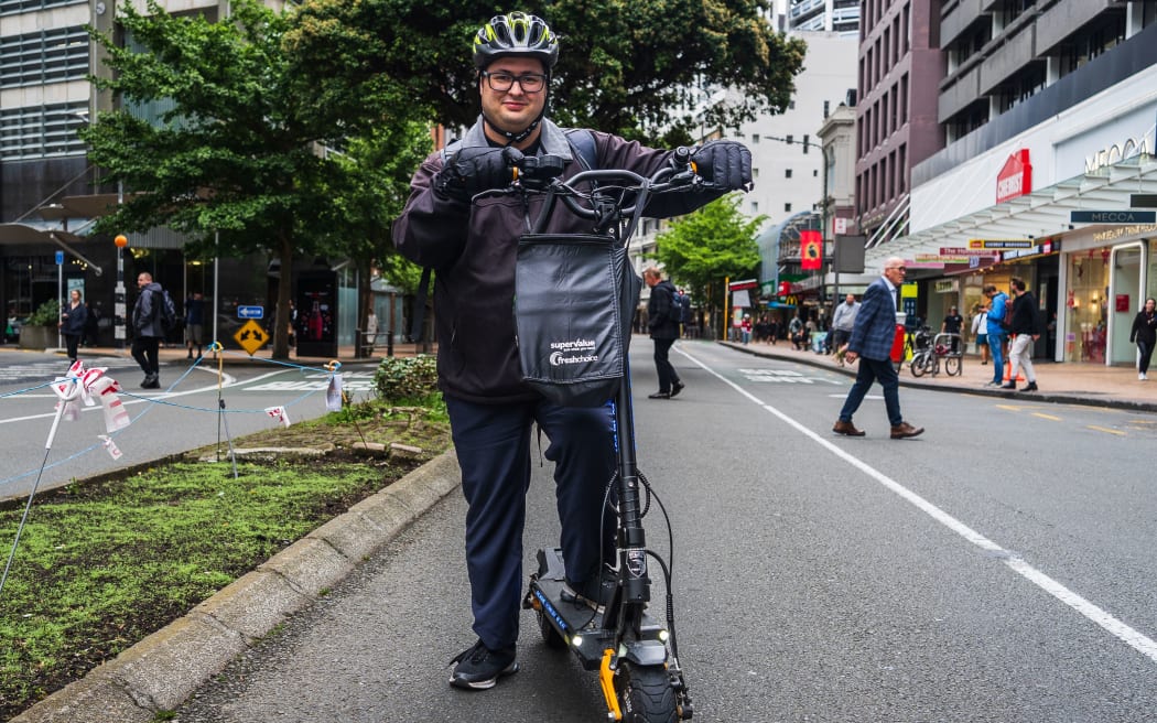 Chris Totton commutes through Lambton Quay on his 2x1200W dual motor e-scooter.