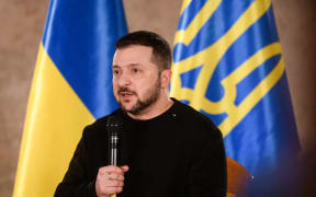 Ukraine's President Volodymyr Zelensky speaks during a questions and answers session with International media representatives in the Latvian National History Museum on January 11, 2024 in Riga, Latvia. (Photo by Gints Ivuskans / AFP)