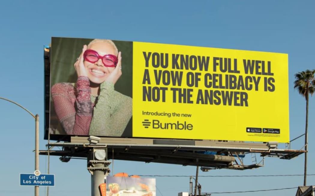 A bright yellow billboard reads: You know full well a vow of celibacy is not the answer